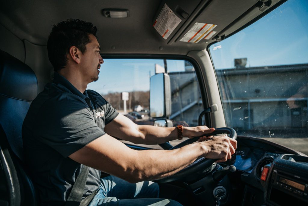 Heather Movers LLC team member driving moving truck